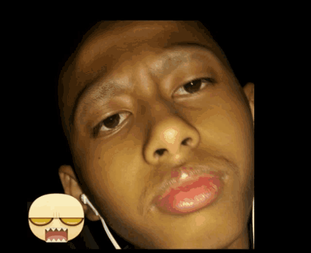 a close up of a person 's face with a smiley face on the bottom right