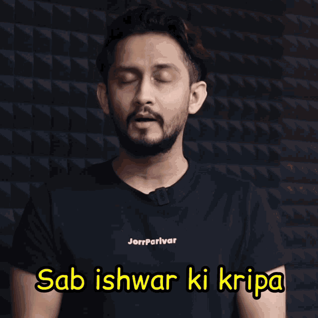 a man wearing a black shirt with the words sab ishwar ki kripa written on it
