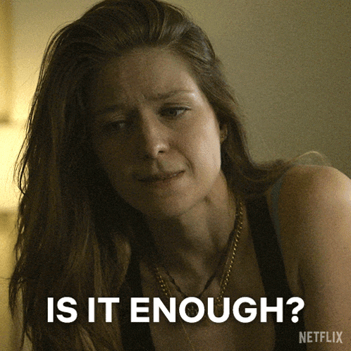 a woman is asking if it is enough with a netflix logo behind her
