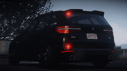 a black car with a california license plate that says 80x1129