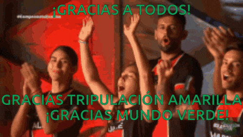 a group of people raising their hands in the air with the words gracias a todos in the background