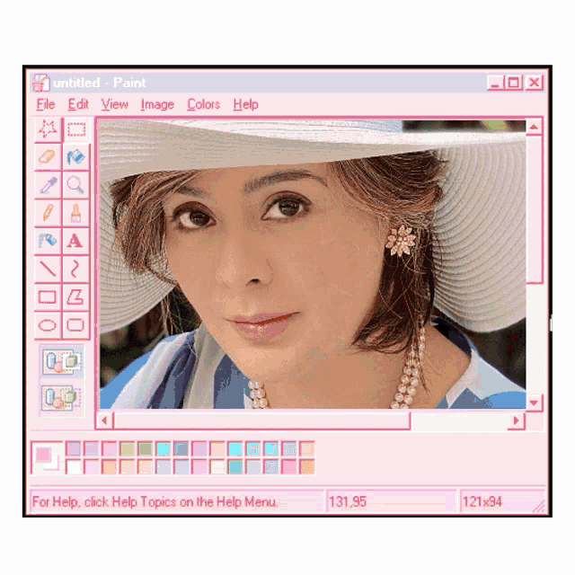 a woman 's face is displayed on a computer screen in a paint window