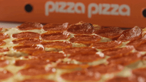 a pepperoni pizza is sitting in front of a pizza box