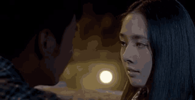 a man and a woman are looking at each other .