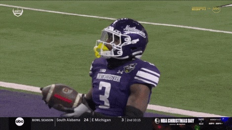 a football player wearing a purple northwestern jersey
