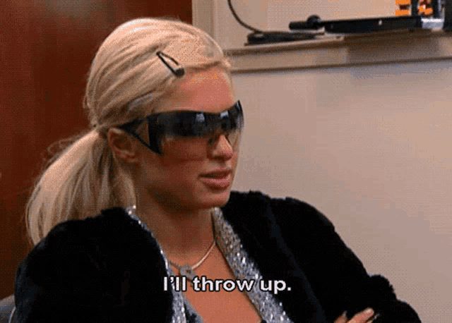 a woman wearing sunglasses and a fur coat is saying i 'll throw up .