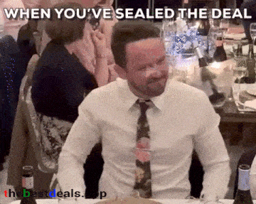 a man in a white shirt and tie is sitting at a table with a caption that says when you 've sealed the deal