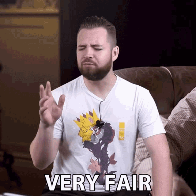 a man with a beard wearing a very fair shirt