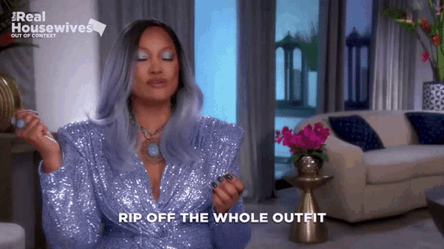 a woman wearing a purple sequined jacket says rip off the whole outfit
