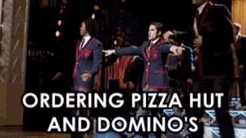 a group of men are dancing on a stage with the words ordering pizza hut and domino 's