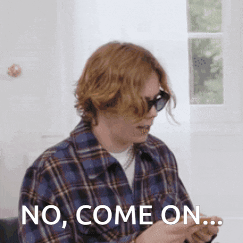 a man wearing sunglasses and a plaid shirt says no come on ..