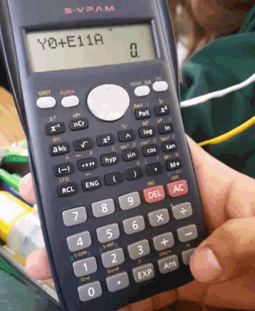 a person is holding a calculator that says y0 + e11a