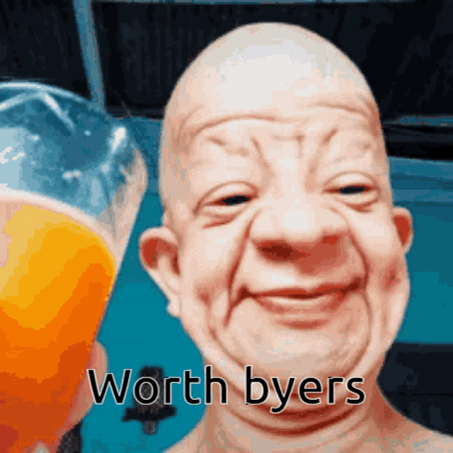 a bald man is smiling while holding a glass of orange juice with the words worth byers written below him