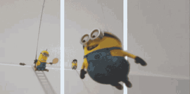 a group of minions hanging from a rope with one holding a red ball