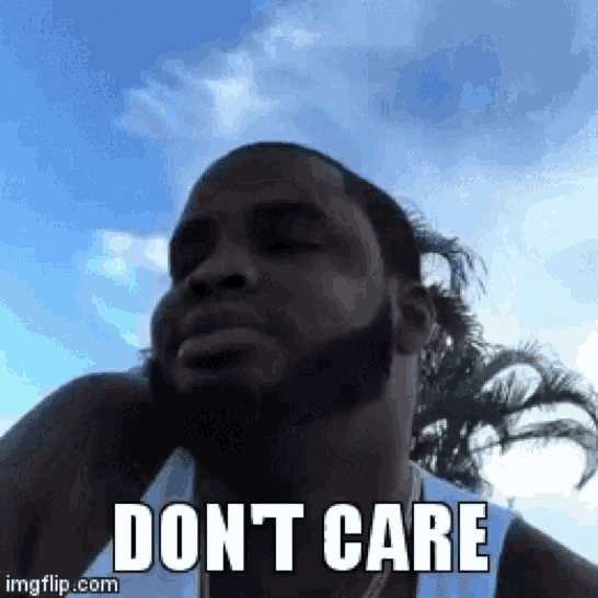 a man with a beard is making a funny face and saying `` don t care '' .