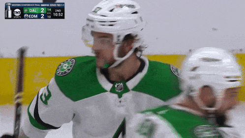 a hockey game is being played and the score is 2 to 10