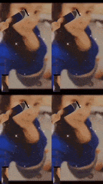 a woman in a blue shirt is holding a microphone