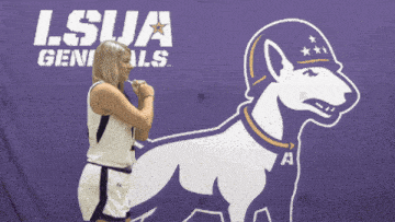 a female basketball player stands in front of a purple lsua generals logo
