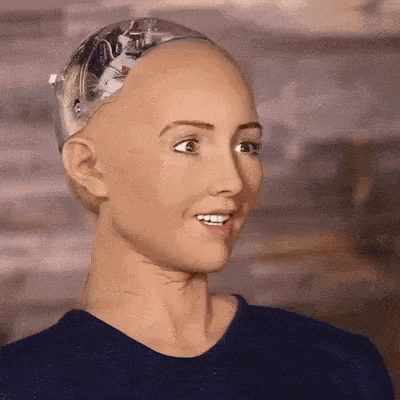 a close up of a robot 's face with a blue shirt on