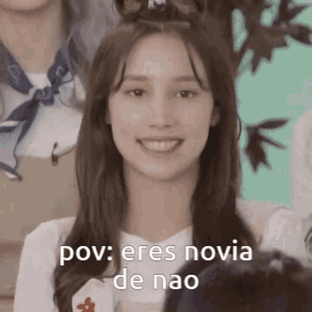 a close up of a woman 's face with the words pov eres novia de nao written on it