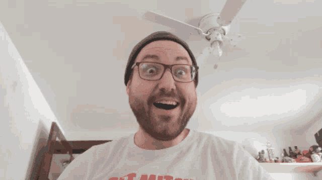 a man wearing glasses and a t-shirt that says chicago