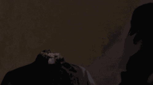 a close up of a person 's face with a bloody neck .