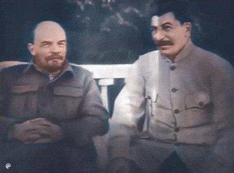 two men are standing next to each other and one has a mustache and the other has a beard