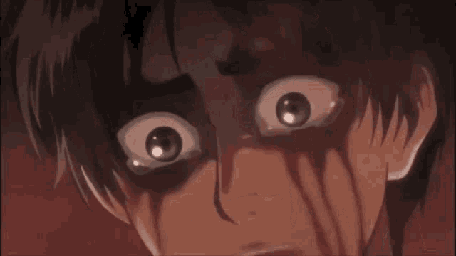 a close up of a person 's face with tears coming out of their eyes