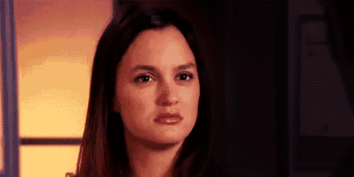 a close up of a woman 's face looking at the camera .