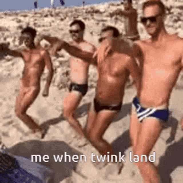 a group of men are dancing on a beach .