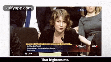 a woman is sitting in front of a microphone with the words that frightens me on the bottom
