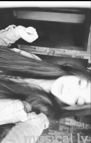 a black and white photo of a girl with the words musically written on the bottom