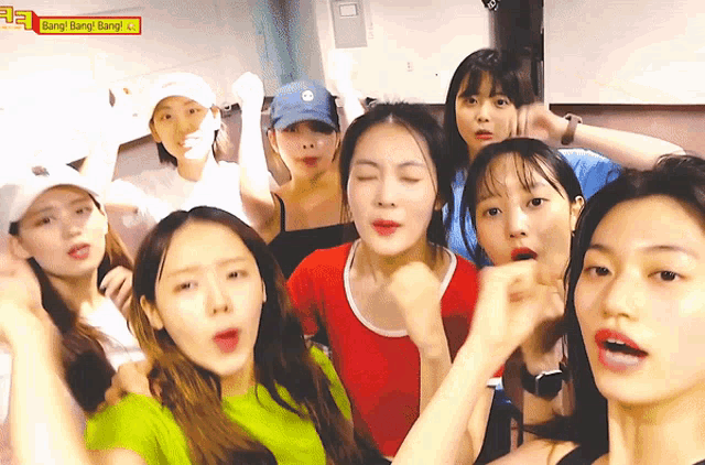 a group of young women are posing for a picture with the words bang bang bang behind them