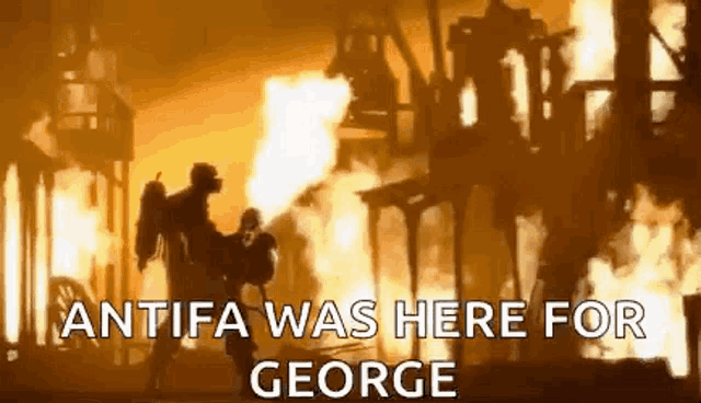 a fireman is carrying a child in front of a burning building with the words `` antifa was here for george '' .