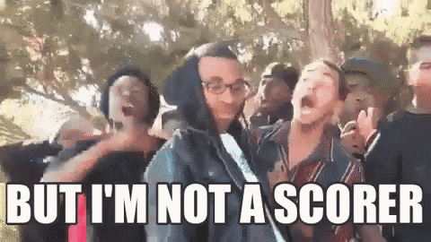 a group of people are standing next to each other and one of them is screaming .