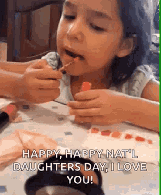 a little girl is applying lipstick to her lips and says `` happy happy nat 'l daughters day , i love you ''