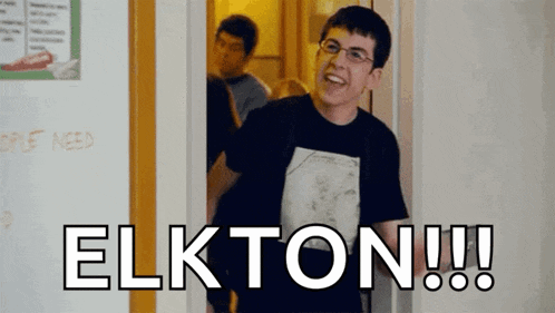a man in a black shirt is standing in a doorway with the word elkton written on it