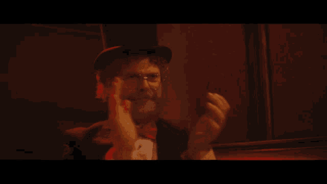 a man with a beard wearing a top hat
