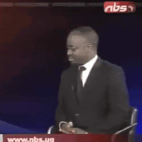 a man in a suit and tie says why are you gae on a tv screen