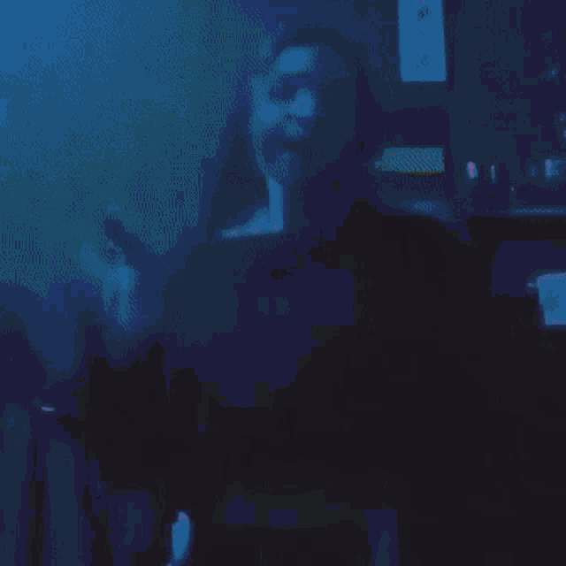 a blurry picture of a person 's face with a red wall in the background