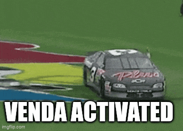 a race car is driving down a race track and the words venda activated are visible .