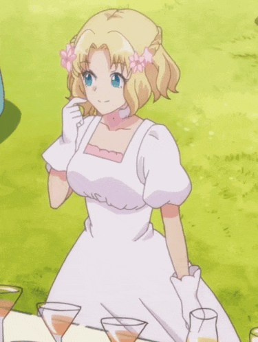 a girl in a white dress with a flower in her hair is sitting at a table