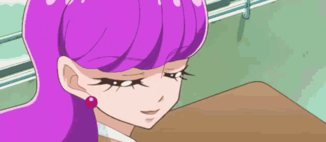 a cartoon girl with purple hair and red earrings is sitting at a desk .