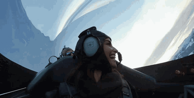 a woman wearing a helmet and headphones with the letters wp on it