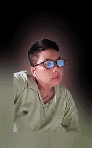 a man wearing glasses is wearing a green shirt with a whale on it