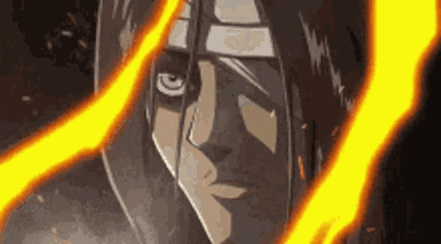 a close up of a person 's face with a fire coming out of his mouth .