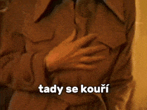 a close up of a person 's face with the words tady se rozbijeji sklenicky written in white