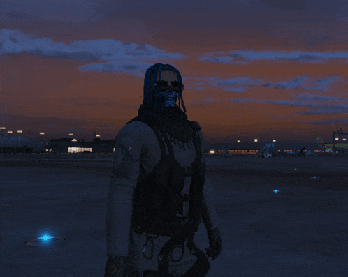 a man wearing a skull mask and sunglasses stands in front of an airport at sunset