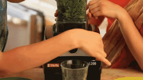 someone is using a vitamix 5200 blender to make a drink