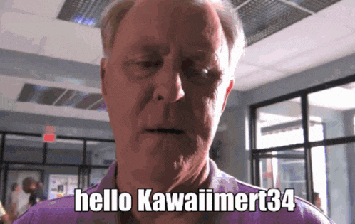 a man says hello kawaimert34 in front of a window